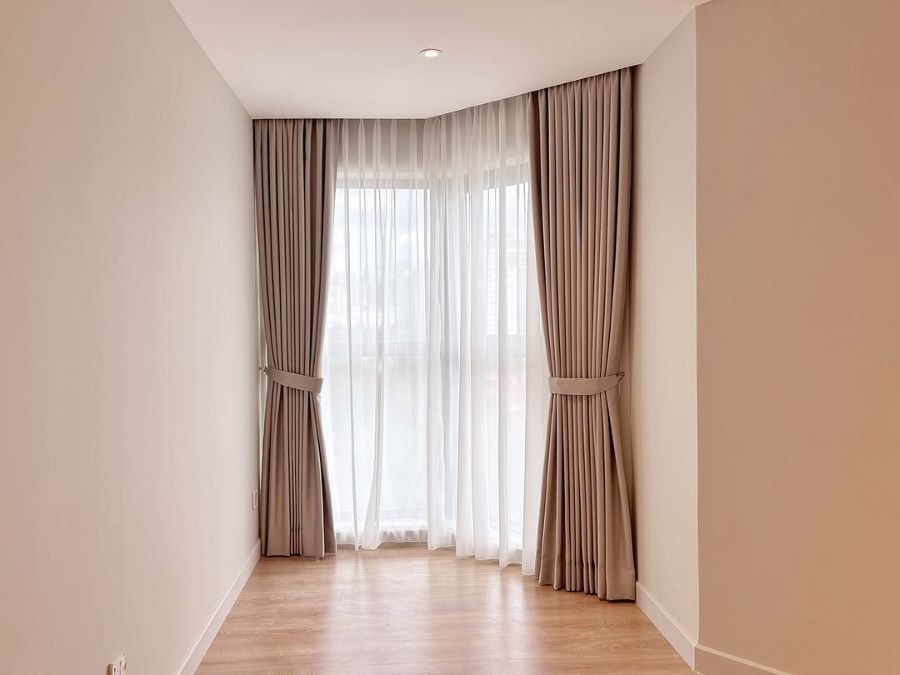 Hang Curtains High to Frame the Wall